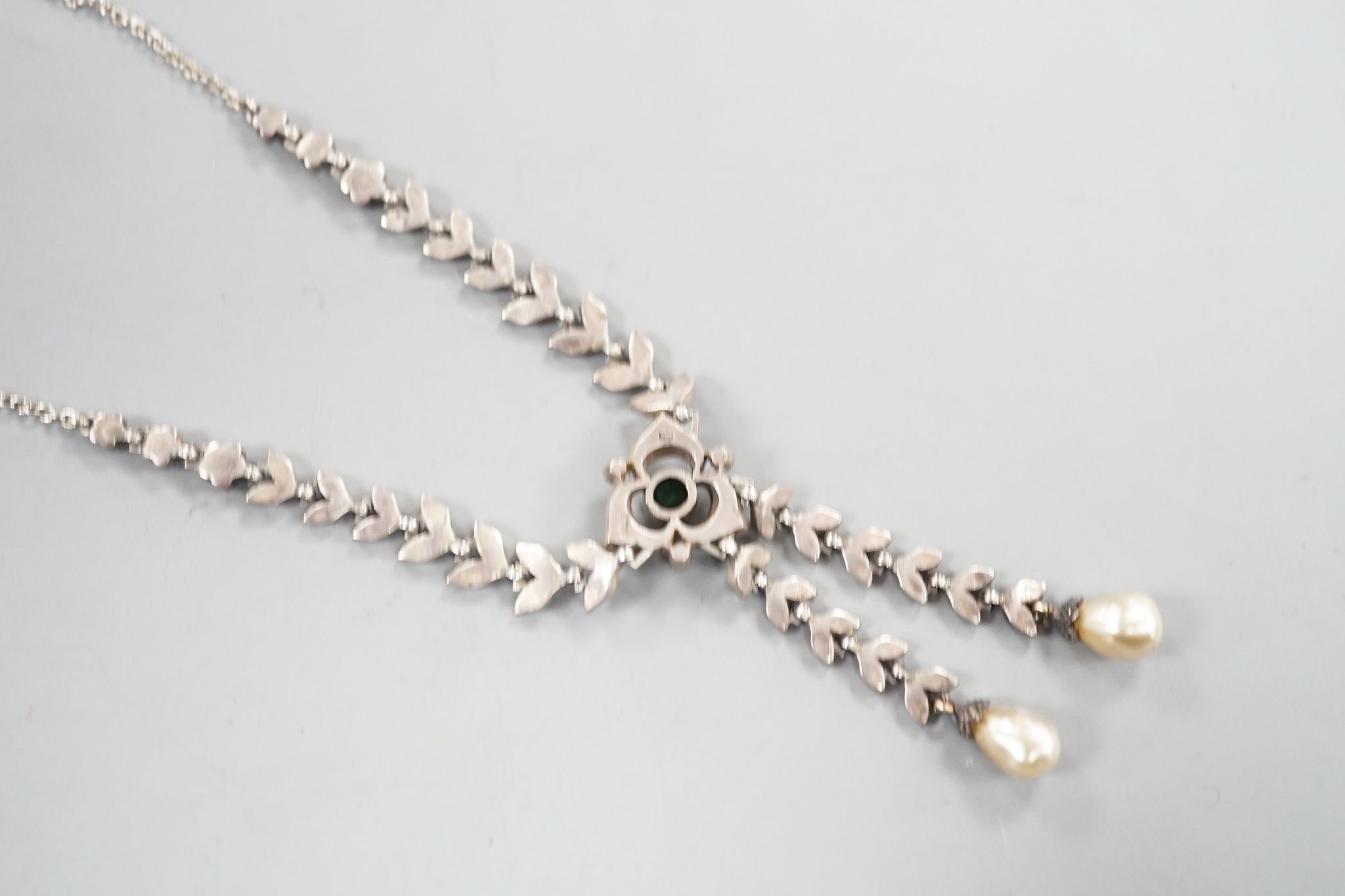 An antique white metal, two colour paste and simulated pearl set drop pendant necklace, 47cm.